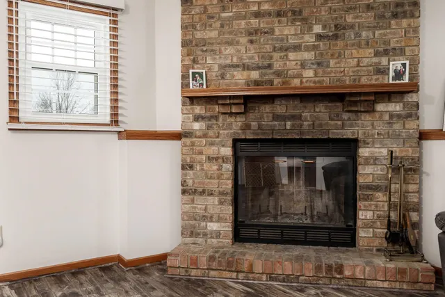 a bed room with a bed and a chair