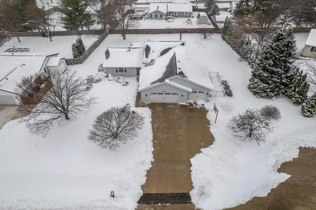 a view of a house with a bed and chair