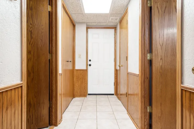 a bedroom with a bed and a table