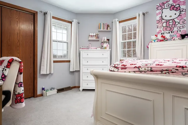 a view of an empty room with a flat screen tv