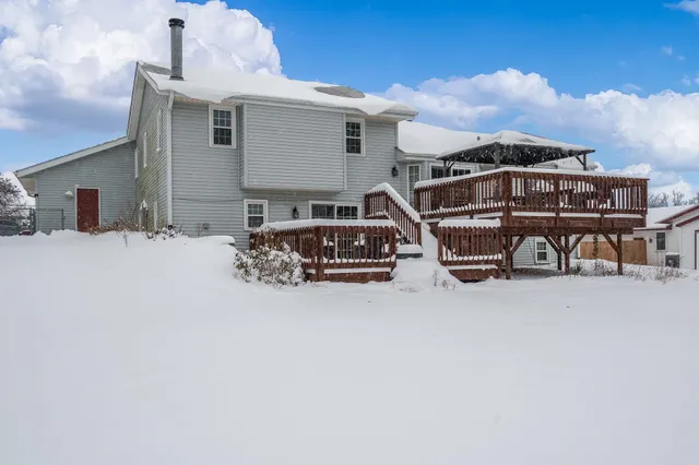 a view of porch with a table and chairs