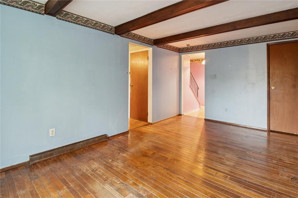 412 Church Road Bethel Park, PA 15102 - Photo 13 of 37 a view of an empty room with wooden floor and a window