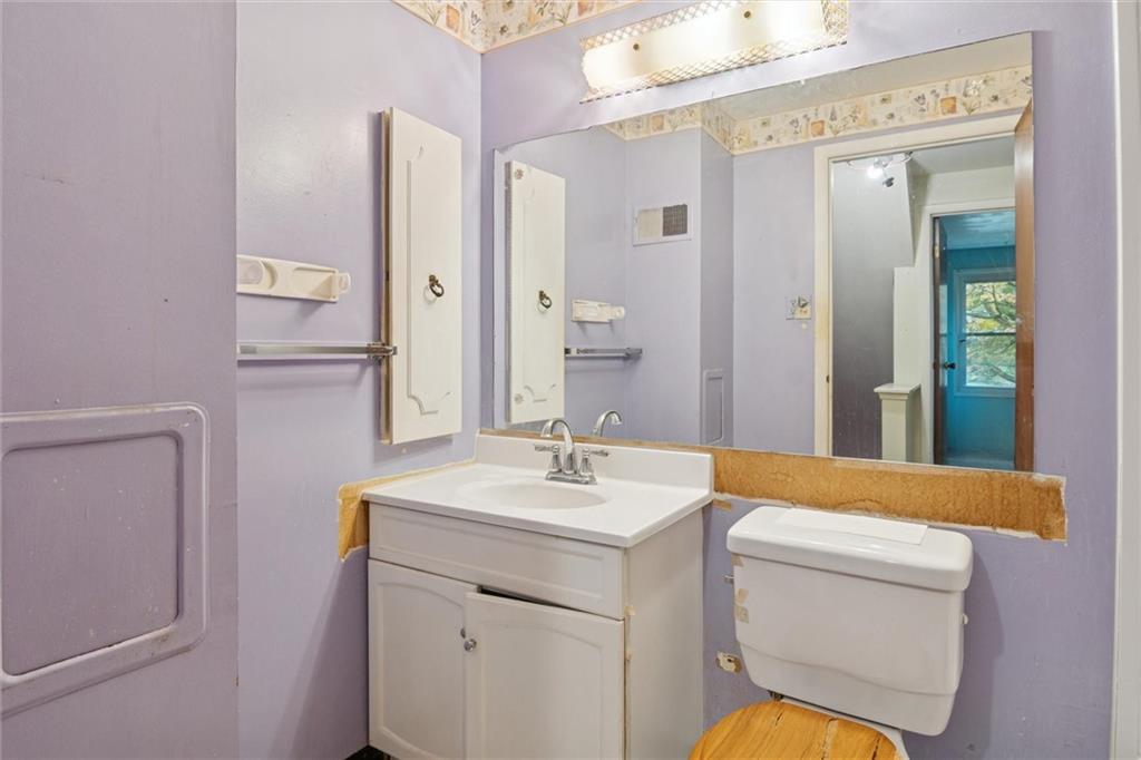 412 Church Road Bethel Park, PA 15102 - Photo 23 of 37 a bathroom with a sink a toilet and a mirror