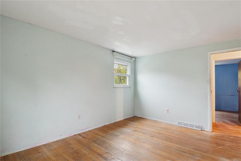 412 Church Road Bethel Park, PA 15102 - Photo 27 of 37 a view of an empty room with wooden floor and closet