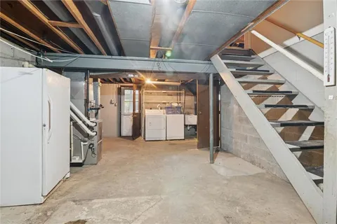 a view of an empty room with stairs