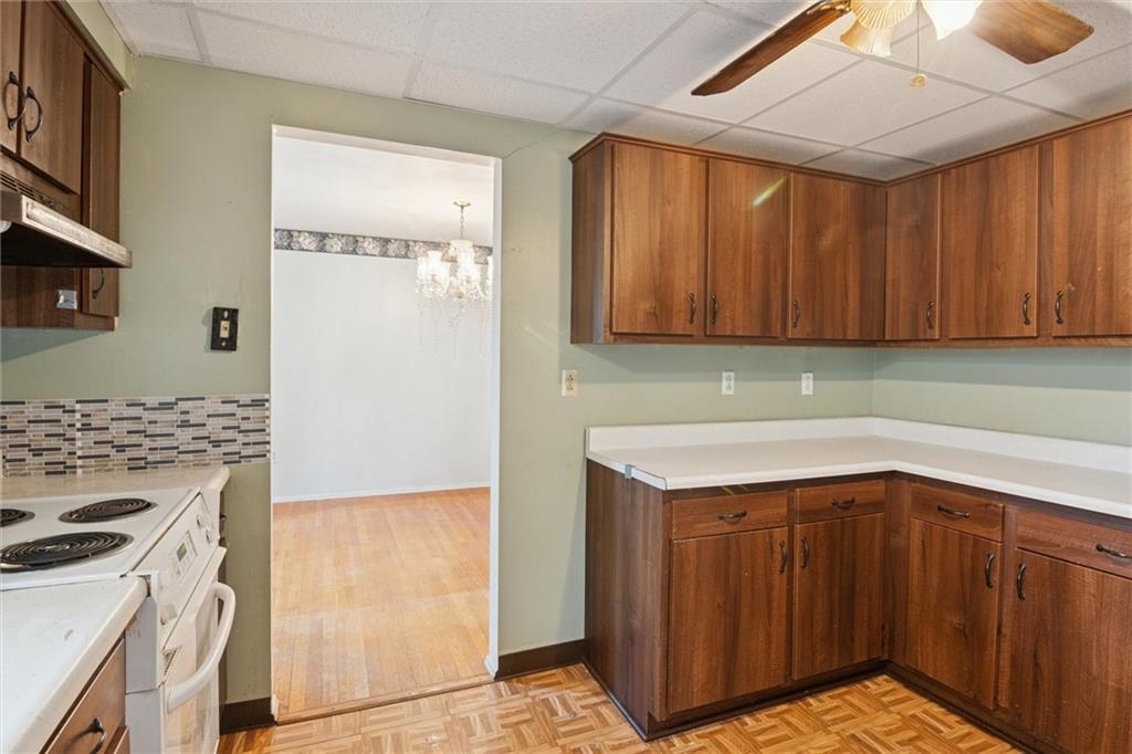 412 Church Road Bethel Park, PA 15102 - Photo 10 of 37 a kitchen with a stove and a refrigerator