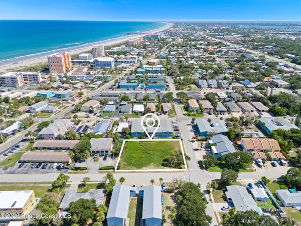 an aerial view of residential building with parking