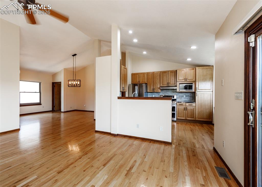 17908 New London Road Monument, CO 80132 - Photo 12 of 41 a view of kitchen with wooden floor and electronic appliances