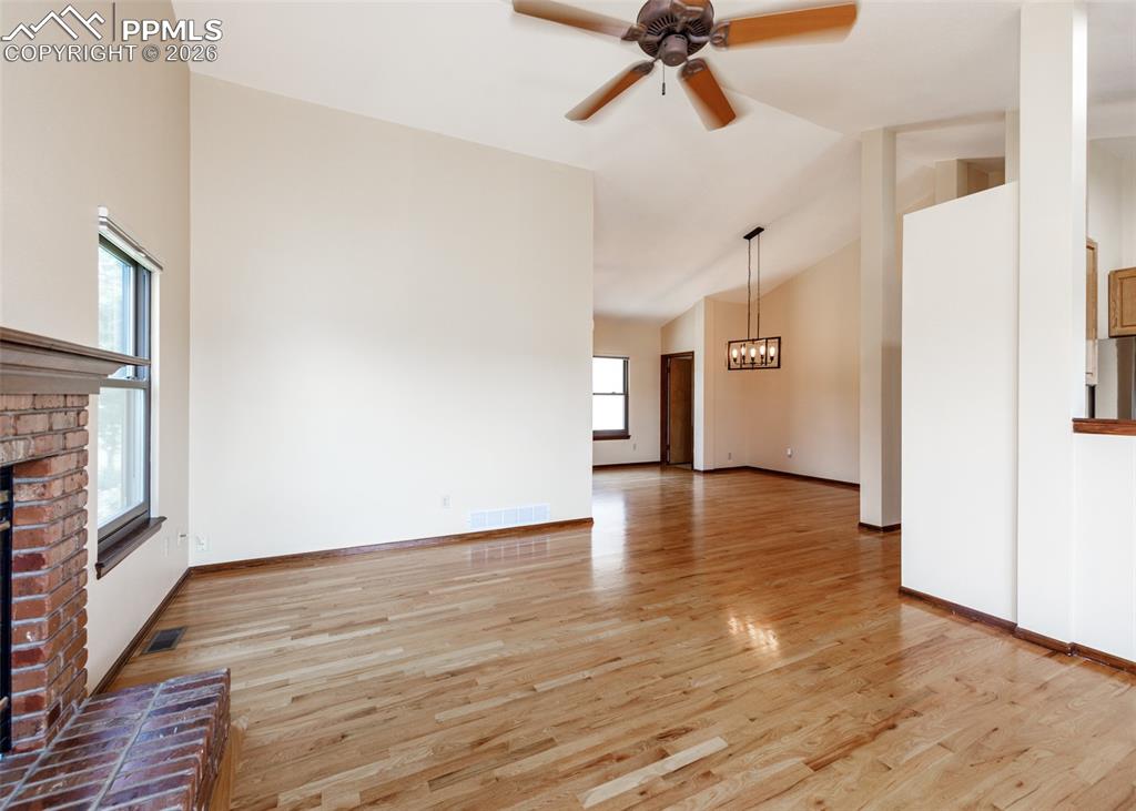 17908 New London Road Monument, CO 80132 - Photo 15 of 41 a view of an empty room with wooden floor and a window
