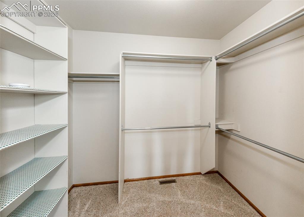 17908 New London Road Monument, CO 80132 - Photo 18 of 41 a white refrigerator freezer a stove and a refrigerator in a kitchen