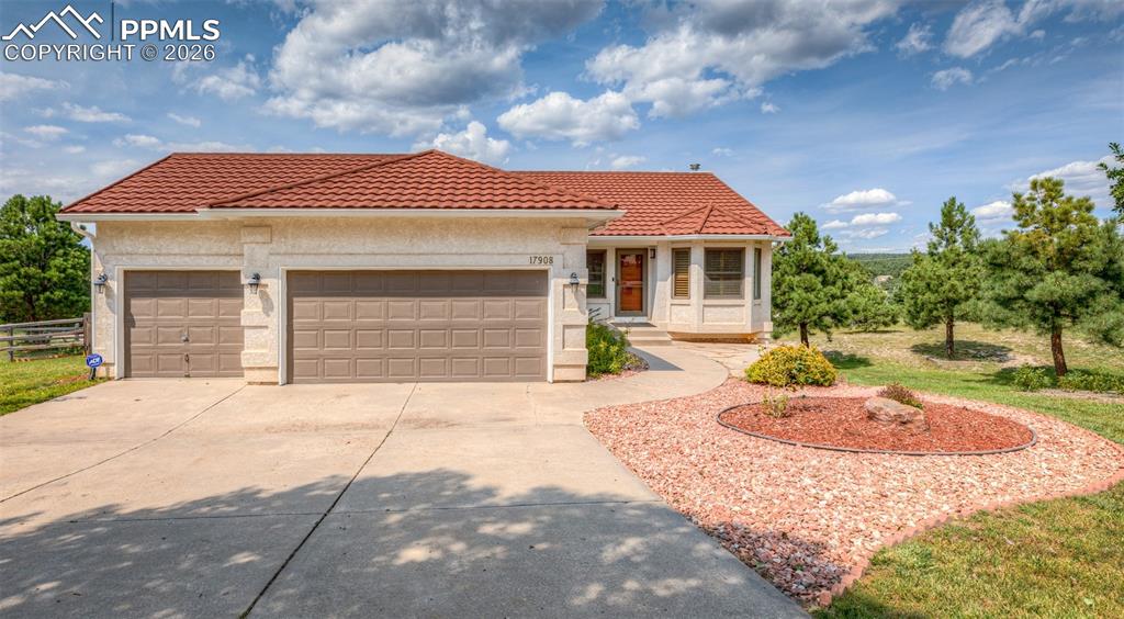 17908 New London Road Monument, CO 80132 - Photo 2 of 41 a front view of a house with a yard