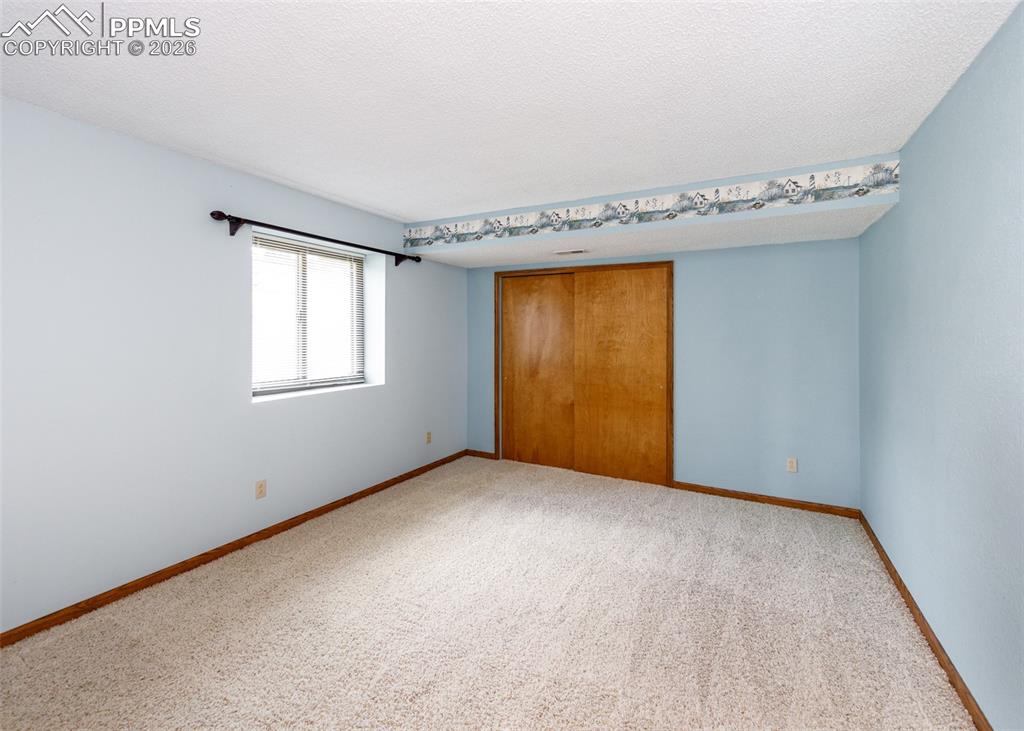 17908 New London Road Monument, CO 80132 - Photo 24 of 41 an empty room with a window