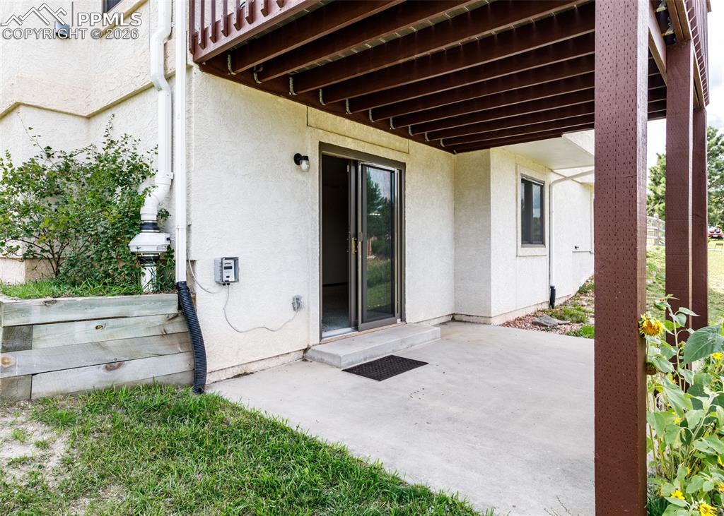 17908 New London Road Monument, CO 80132 - Photo 33 of 41 a view of a porch with wooden floor and stairs