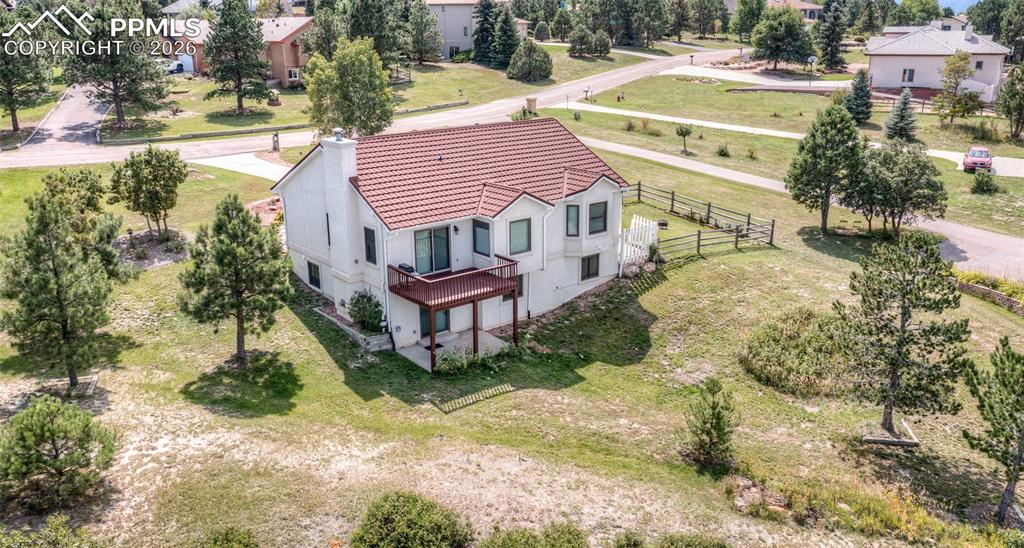 17908 New London Road Monument, CO 80132 - Photo 40 of 41 a aerial view of a house with a yard