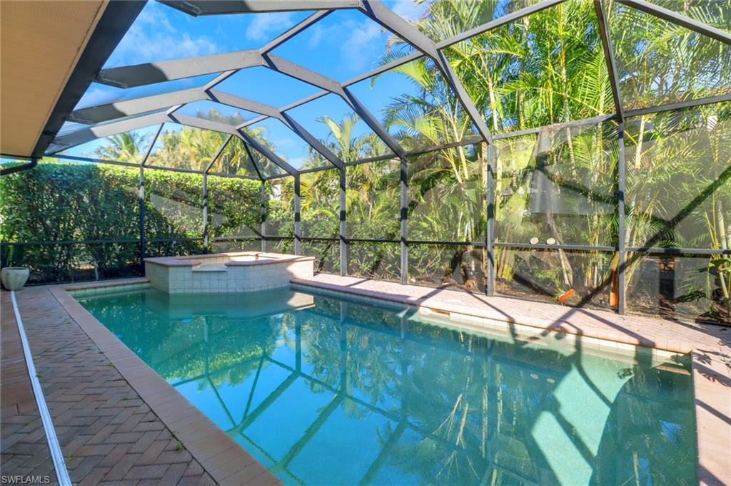 1233 Kendari Terrace Naples, FL 34113 - Photo 20 of 38 a view of swimming pool with a yard