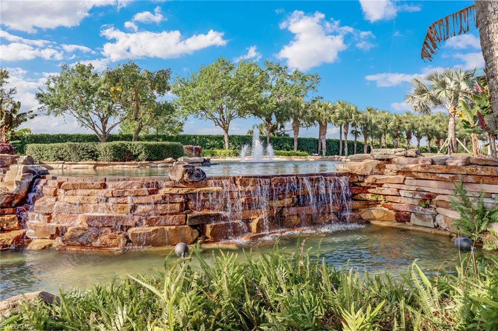 1233 Kendari Terrace Naples, FL 34113 - Photo 24 of 38 a view of a lake with a house