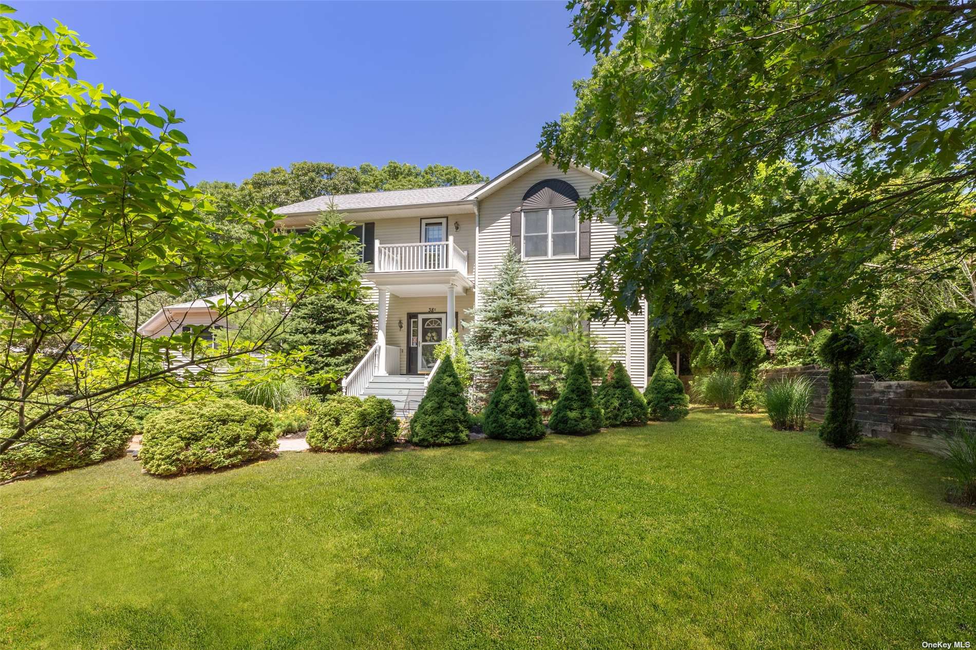 38 Cove Road South Southampton, NY 11968 - Photo 1 of 1 a view of a house with backyard and garden