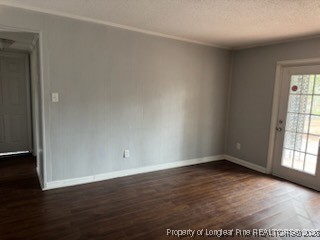 817 Ridge Road, Unit D Fayetteville, NC 28311 - Photo 3 of 9 an empty room with wooden floor and windows