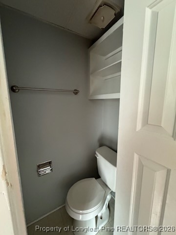 817 Ridge Road, Unit D Fayetteville, NC 28311 - Photo 7 of 9 a white toilet sitting next to a shower