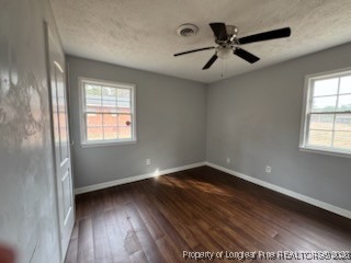 817 Ridge Road, Unit D Fayetteville, NC 28311 - Photo 9 of 9 an empty room with wooden floor fan and windows