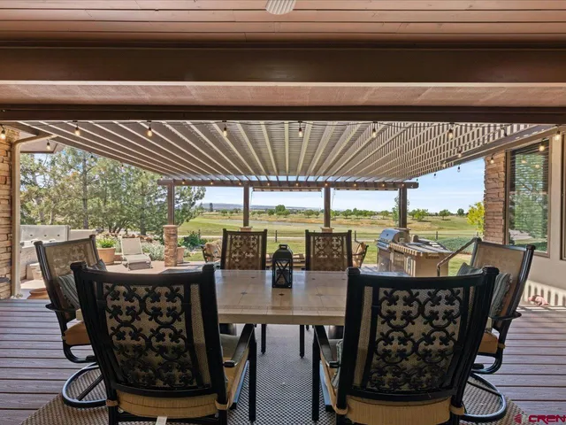 a dining room with furniture window and outdoor view