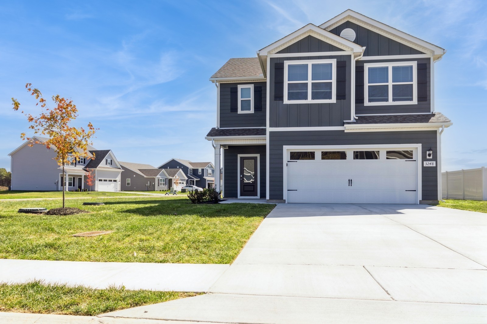 a front view of a house with a yard