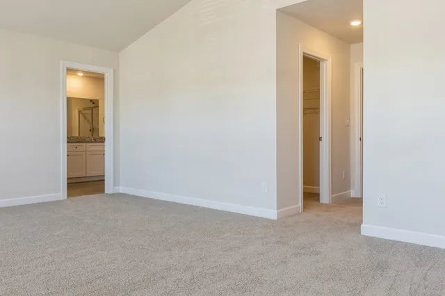 an empty room with closet area