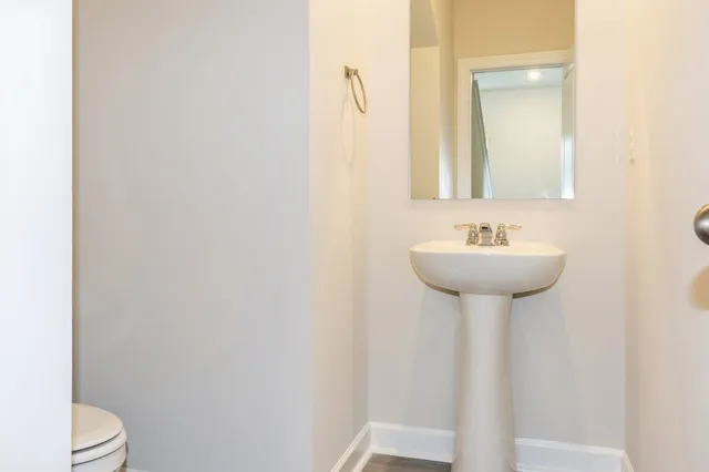 a bathroom with a sink toilet