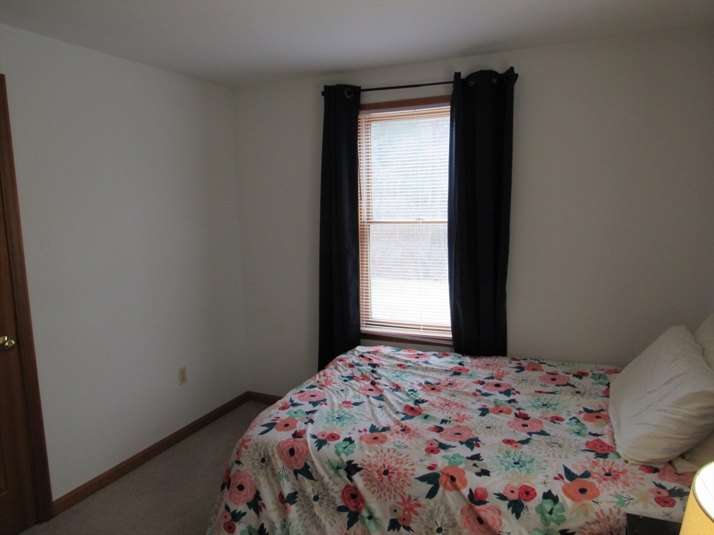 7 Beebe Road Monson, MA 01057 - Photo 19 of 30 a bedroom with a bed and a window