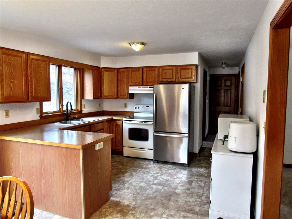 7 Beebe Road Monson, MA 01057 - Photo 9 of 30 a kitchen with a refrigerator sink and stove