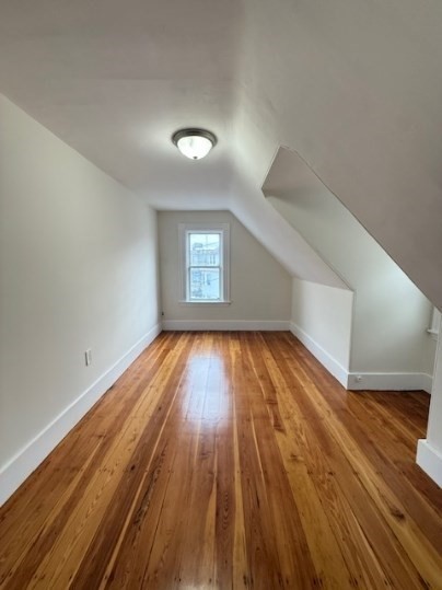 5 Alcott Street, Unit 2 Boston, MA 02134 - Photo 11 of 14 wooden floor in an empty room with a window