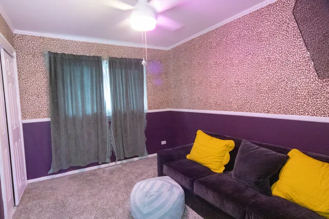 a living room with furniture and a lamp