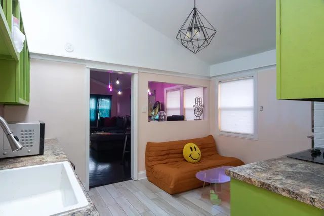 a bedroom with a bed dresser and a window