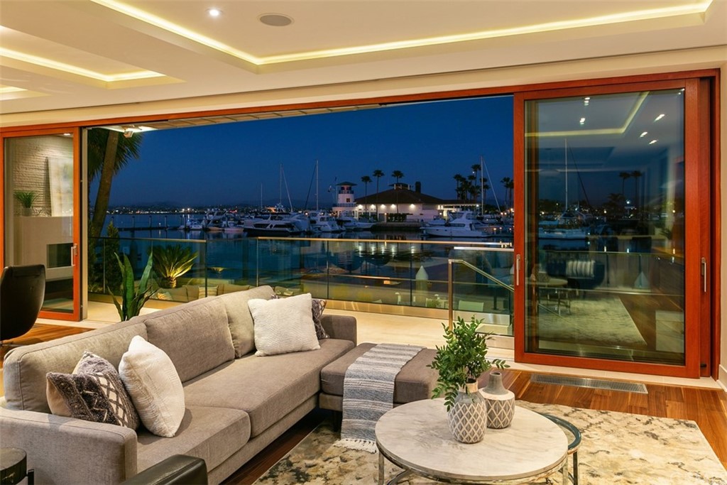 9 Green Turtle Road Coronado, CA 92118 - Photo 1 of 1 a living room with furniture and a fireplace