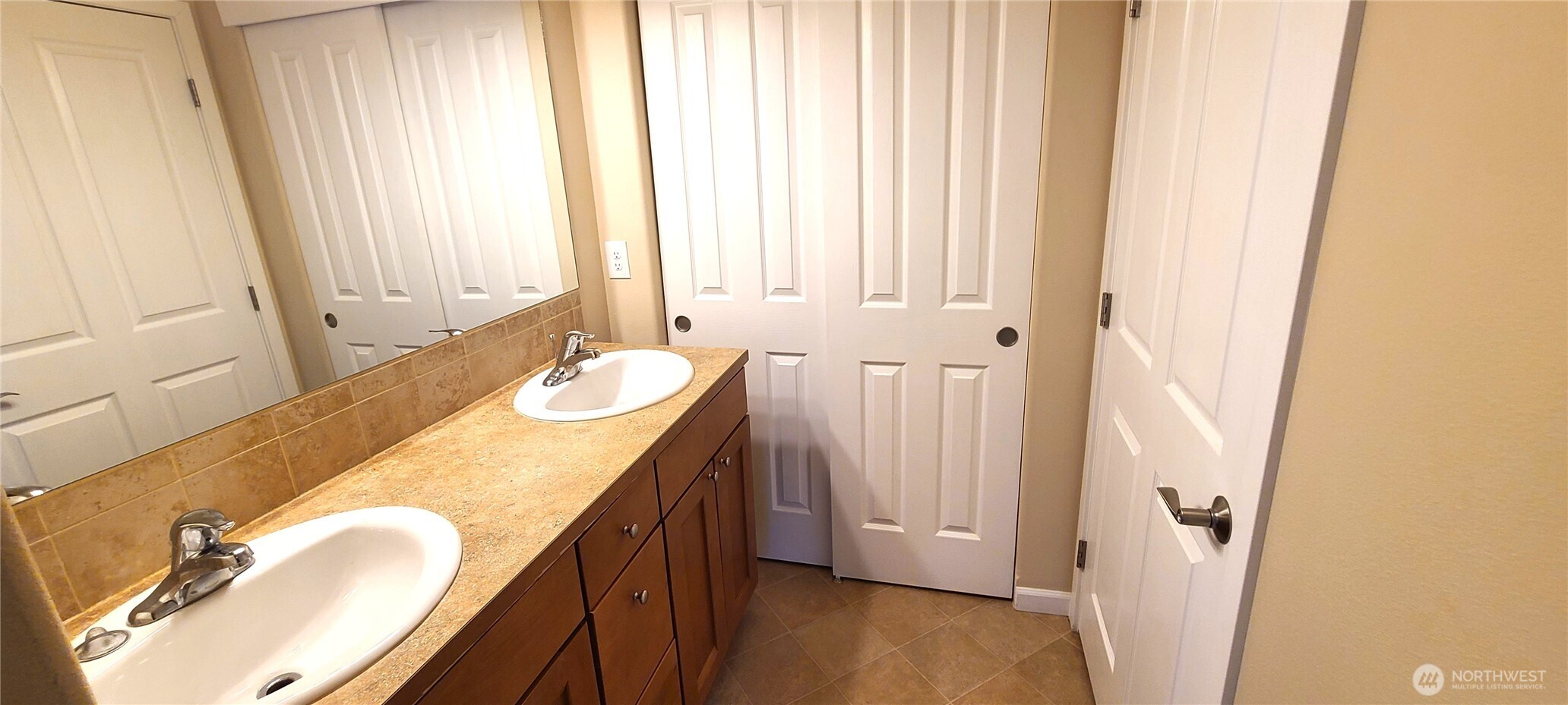 50 Goldenrod Lane Sequim, WA 98382 - Photo 13 of 24 a bathroom with a granite countertop sink and a mirror