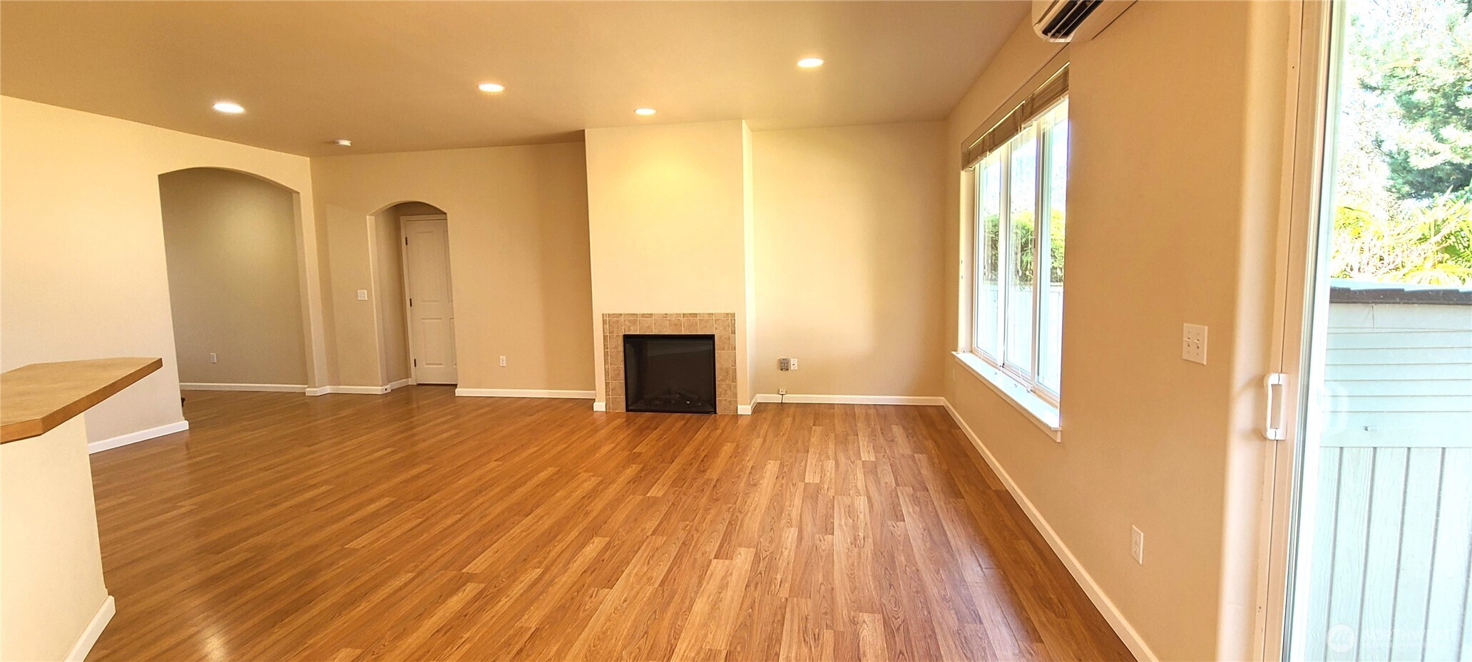 50 Goldenrod Lane Sequim, WA 98382 - Photo 9 of 24 a view of an empty room with wooden floor and a window