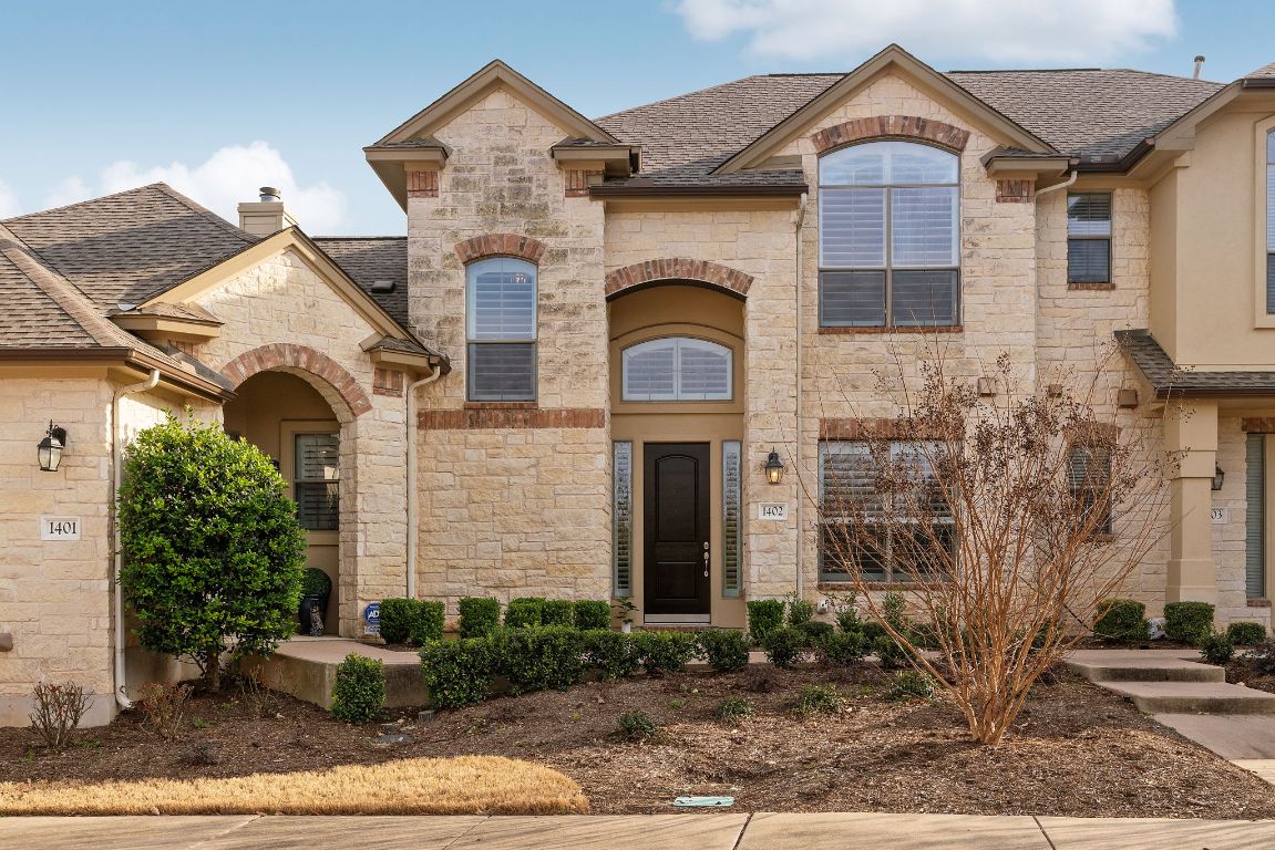 14100 Avery Ranch Boulevard, Unit 1402 Austin, TX 78717 - Photo 1 of 1 a front view of a house with garden