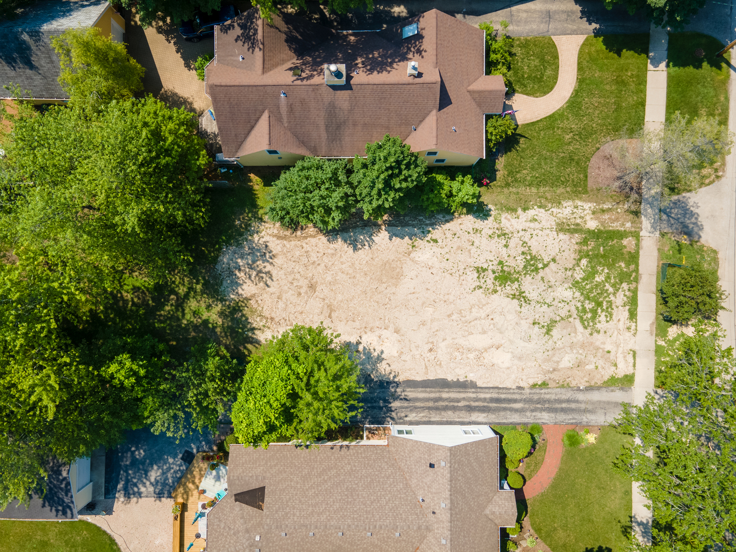 163 Washington Road Lake Forest, IL 60045 - Photo 8 of 8 an aerial view of a house with a yard and lake view