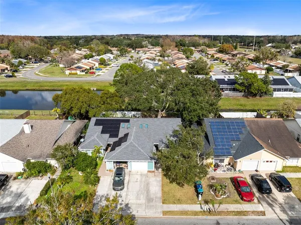 an aerial view of residential houses with outdoor space