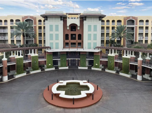 a backyard of a house with yard and sitting area