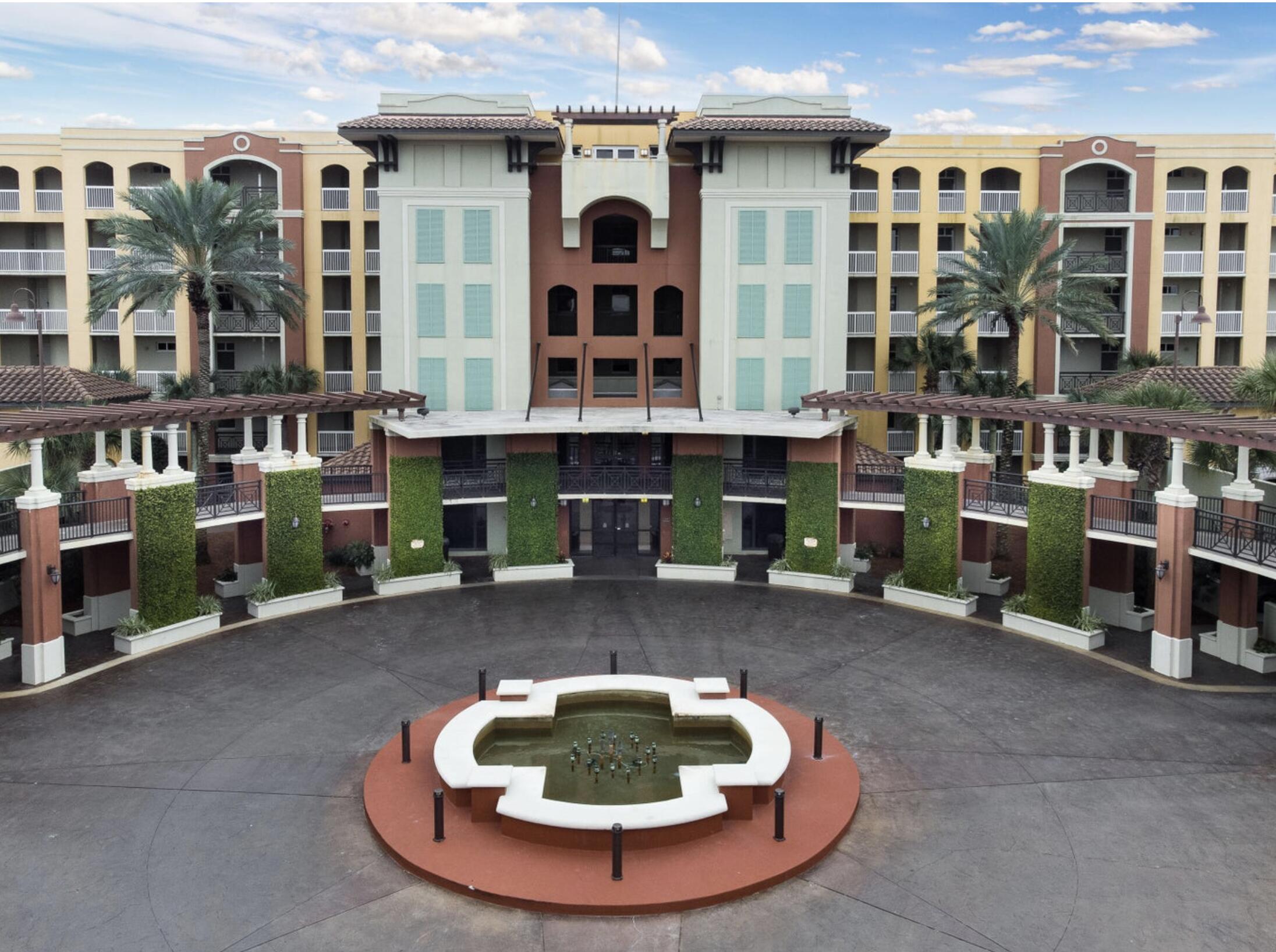 a backyard of a house with yard and sitting area