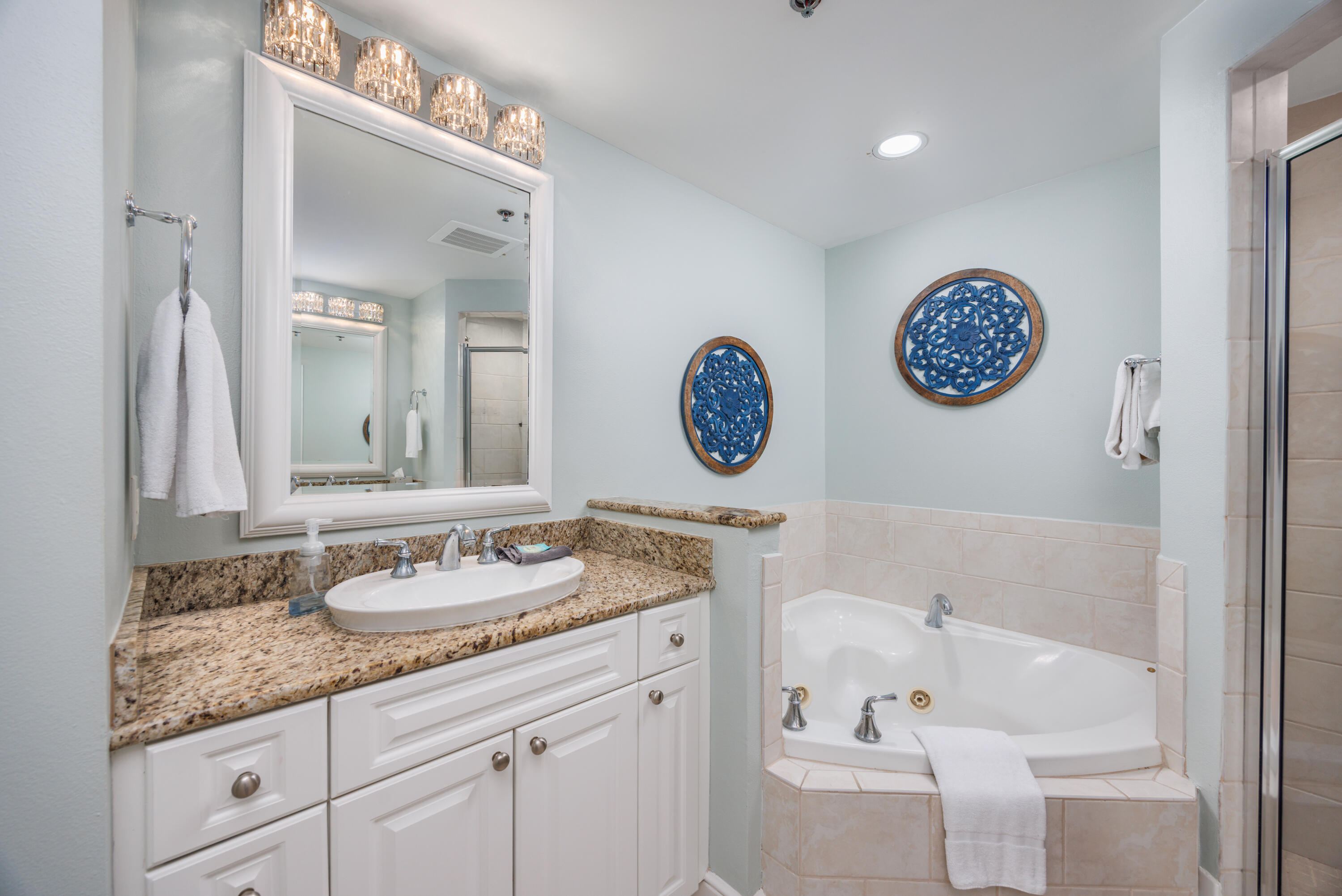 1150 Santa Rosa Boulevard, Unit 421 Fort Walton Beach, FL 32548 - Photo 15 of 46 a bathroom with a granite countertop sink and a mirror