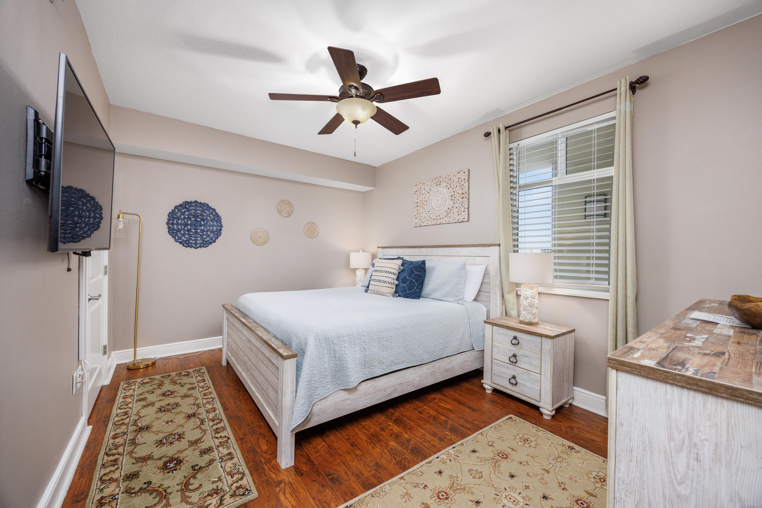 1150 Santa Rosa Boulevard, Unit 421 Fort Walton Beach, FL 32548 - Photo 17 of 46 a bedroom with a bed and a lamp on dresser