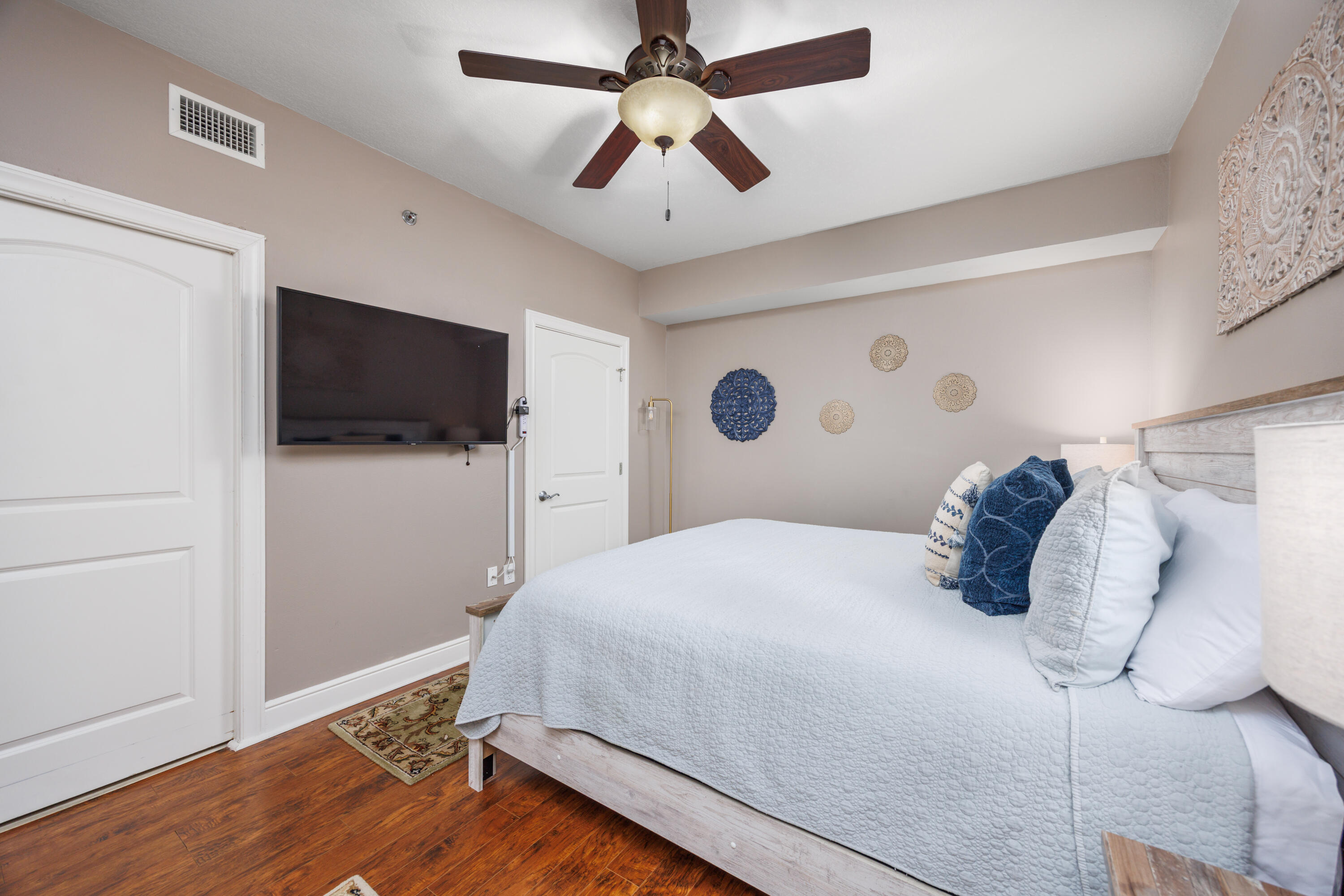 1150 Santa Rosa Boulevard, Unit 421 Fort Walton Beach, FL 32548 - Photo 18 of 46 a bedroom with a bed and a flat screen tv