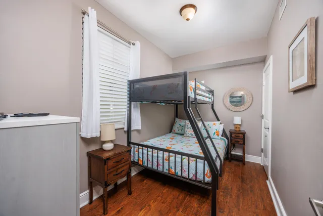 a bedroom with furniture and a window