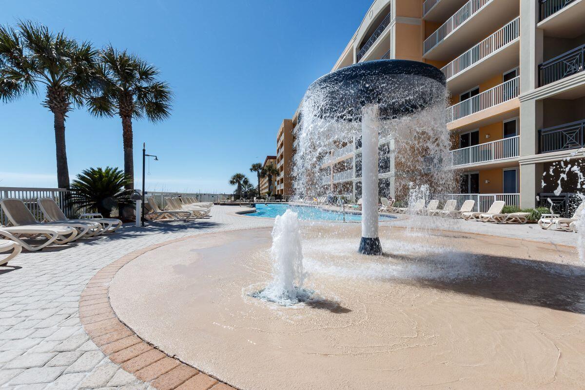 1150 Santa Rosa Boulevard, Unit 421 Fort Walton Beach, FL 32548 - Photo 30 of 46 a terrace with palm trees