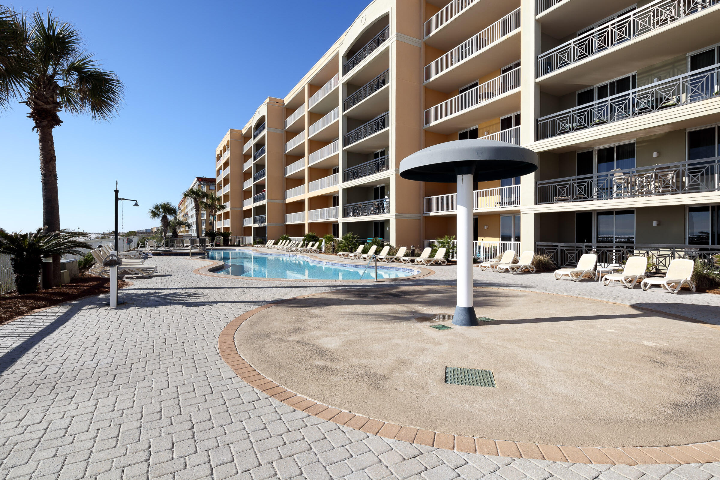 1150 Santa Rosa Boulevard, Unit 421 Fort Walton Beach, FL 32548 - Photo 31 of 46 a view of a building with a swimming pool