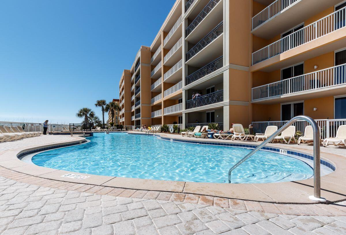 1150 Santa Rosa Boulevard, Unit 421 Fort Walton Beach, FL 32548 - Photo 33 of 46 a view of swimming pool from a patio