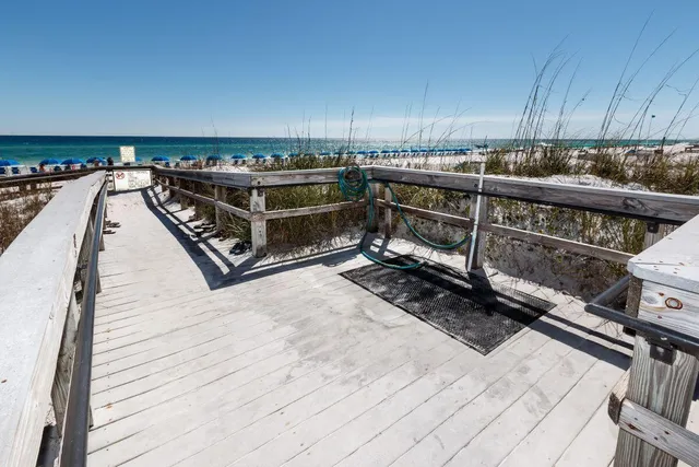 a view of a roof deck with wooden floor and fence