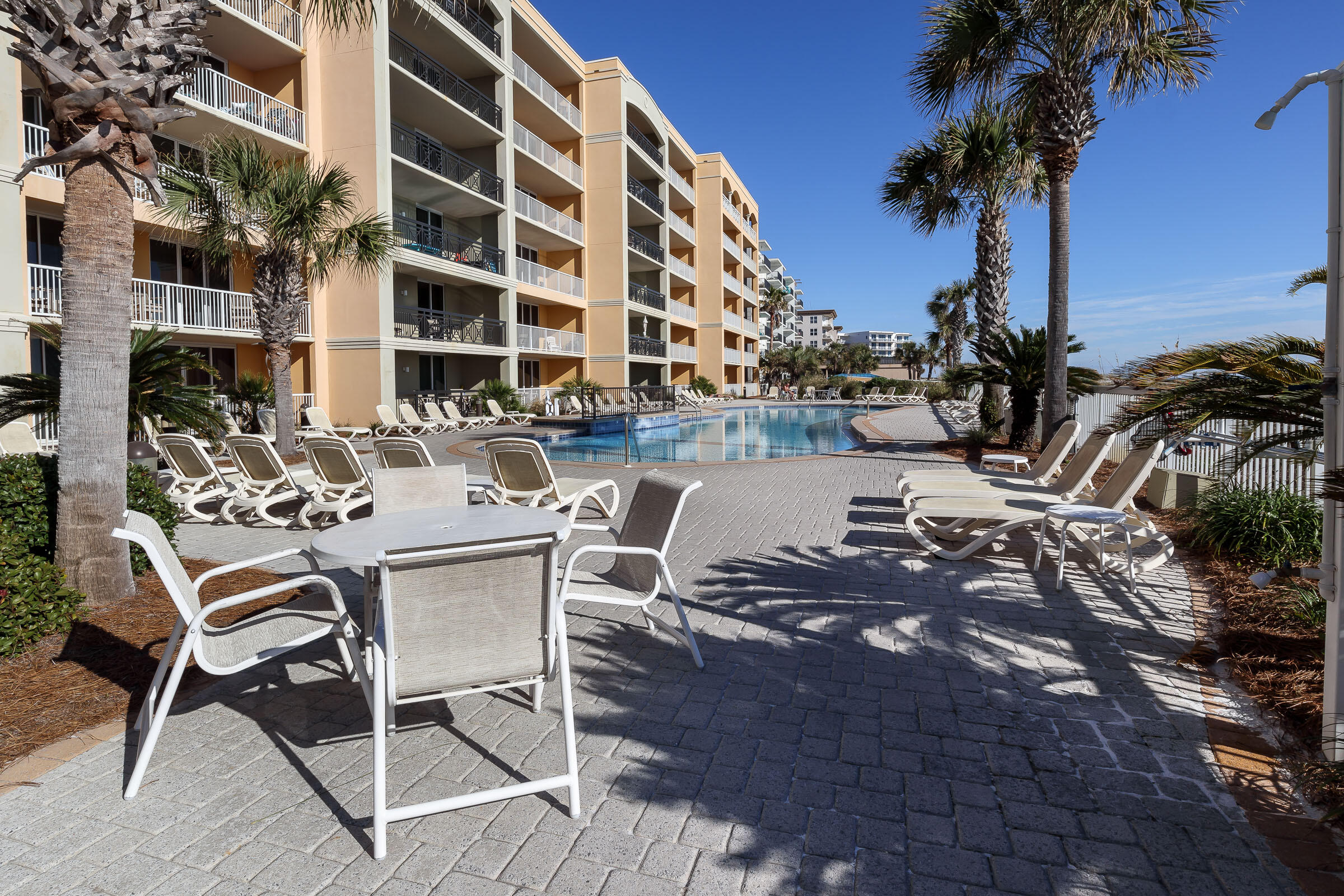 1150 Santa Rosa Boulevard, Unit 421 Fort Walton Beach, FL 32548 - Photo 43 of 46 a view of a chairs and table in the patio